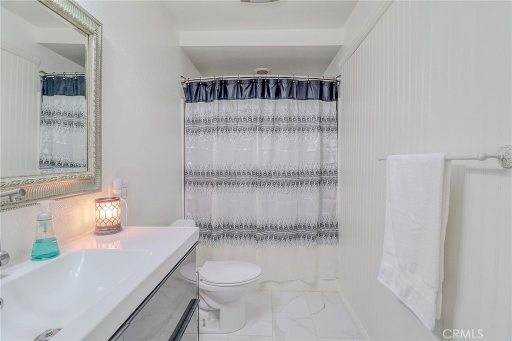 30630 Southern Cross Road Temecula, CA 92592 - Photo 23 of 42 a bathroom with a sink a toilet and shower