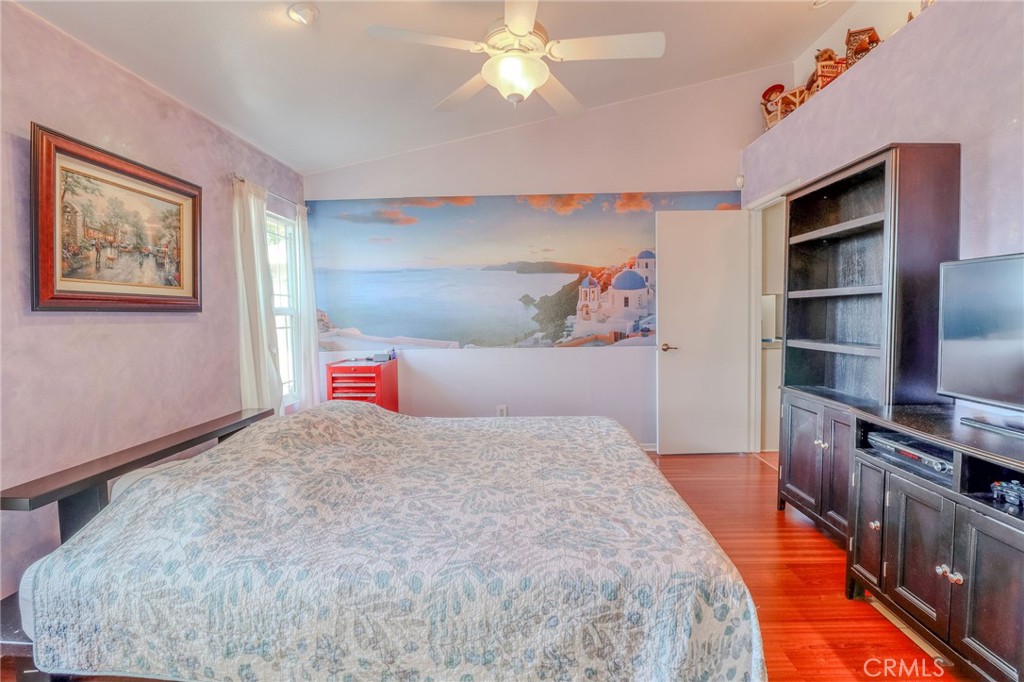 30630 Southern Cross Road Temecula, CA 92592 - Photo 27 of 42 a bedroom with a bed and a book shelf