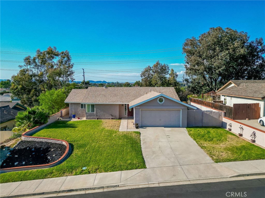 30630 Southern Cross Road Temecula, CA 92592 - Photo 3 of 42 a view of a house with a yard and potted plants