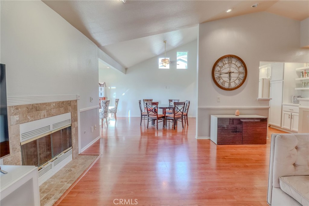 30630 Southern Cross Road Temecula, CA 92592 - Photo 9 of 42 a view of a livingroom with furniture fireplace and wooden floor