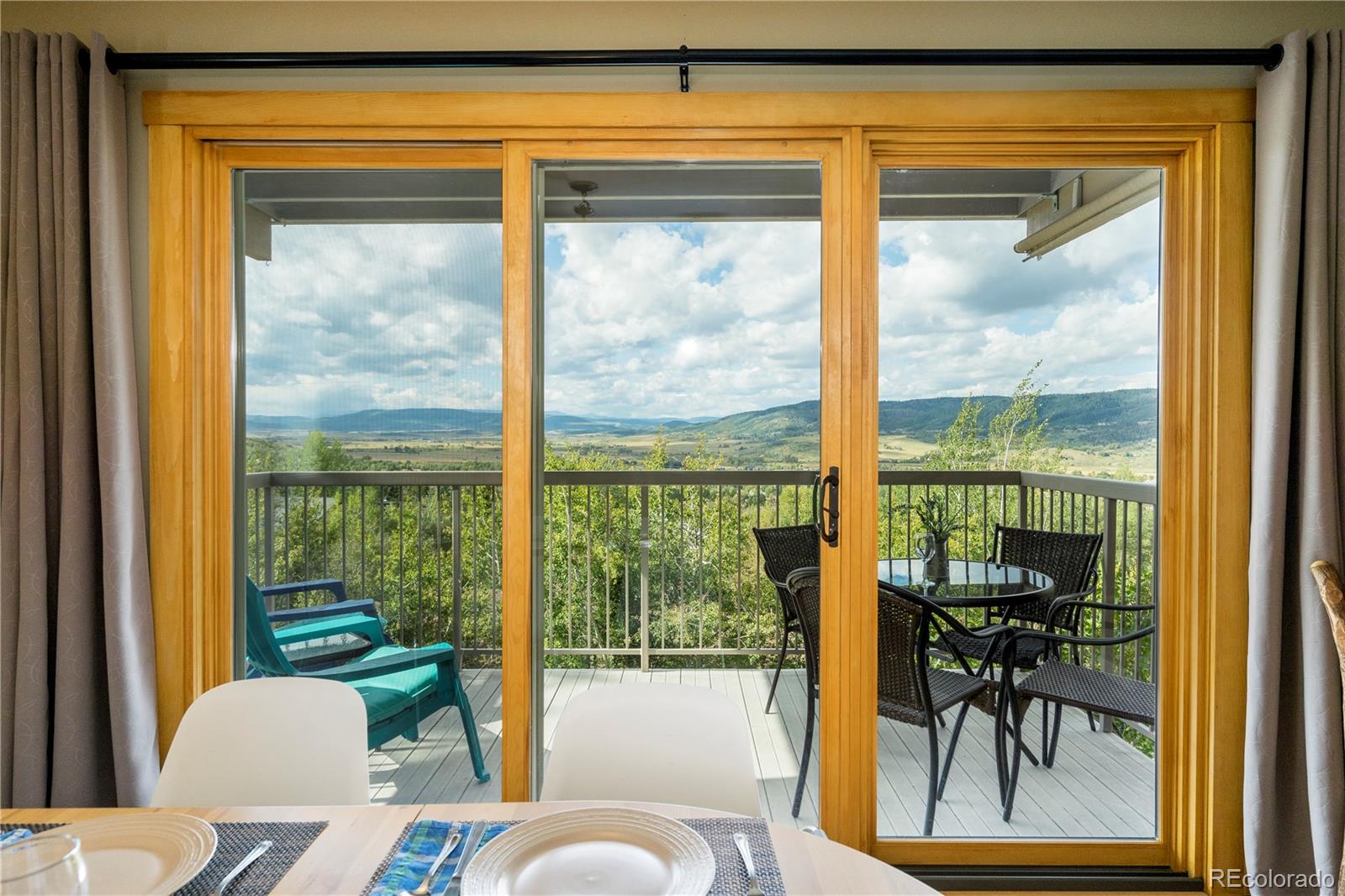 2602 Longthong Road, Unit 105 Steamboat Springs, CO 80487 - Photo 1 of 25 Expansive view of the valley from inside the condo