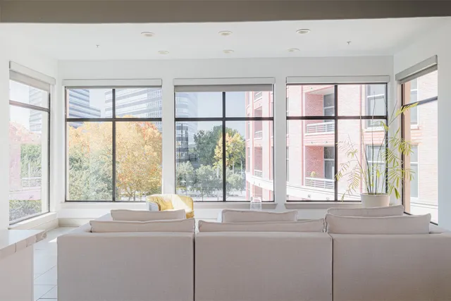 a dining room with furniture and window