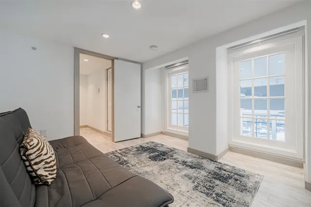 a bathroom with a tub sink and vanity