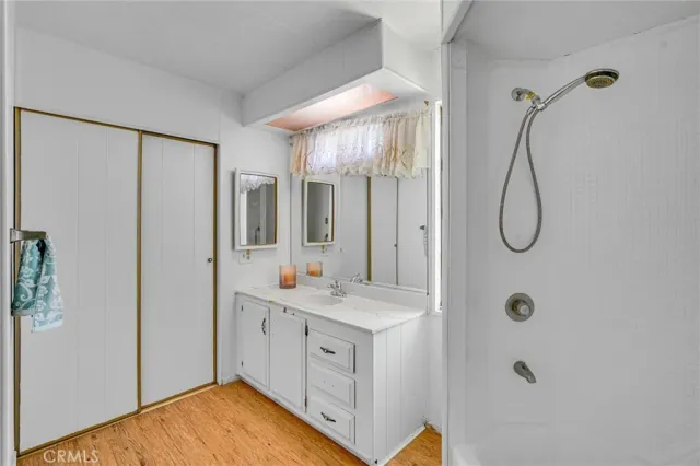 a white toilet sitting next to a bathroom sink