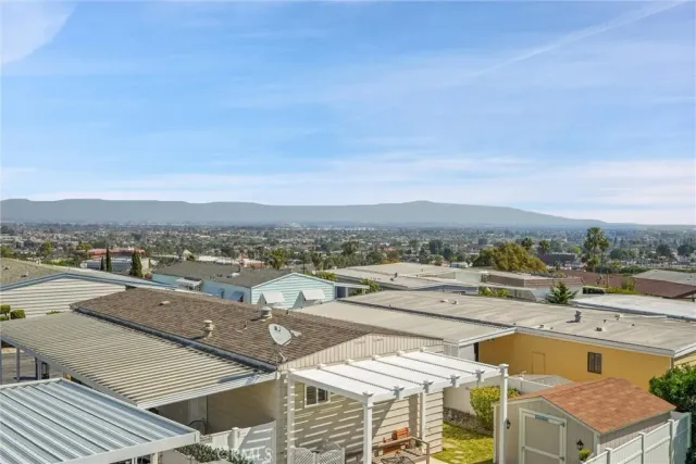 an aerial view of residential building and ocean view