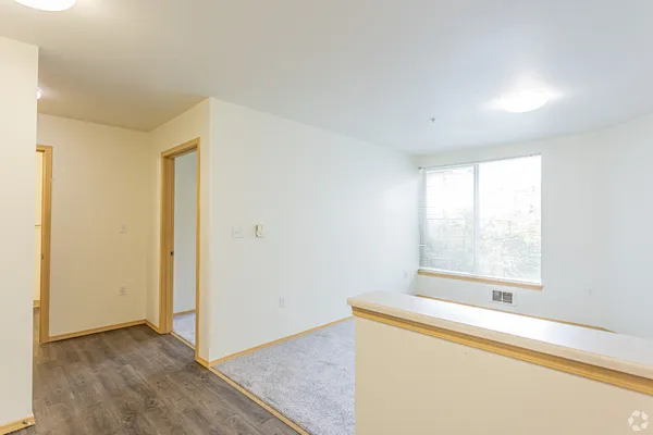a view of an empty room with a window