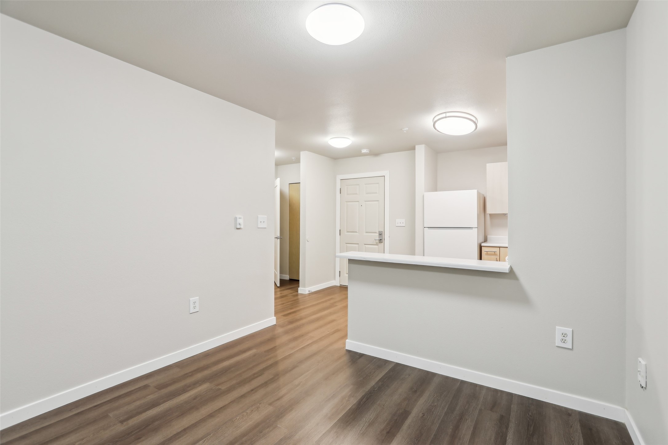 6940 37th Avenue South Seattle, WA 98118 - Photo 32 of 50 a view of a kitchen with wooden floor and a sink
