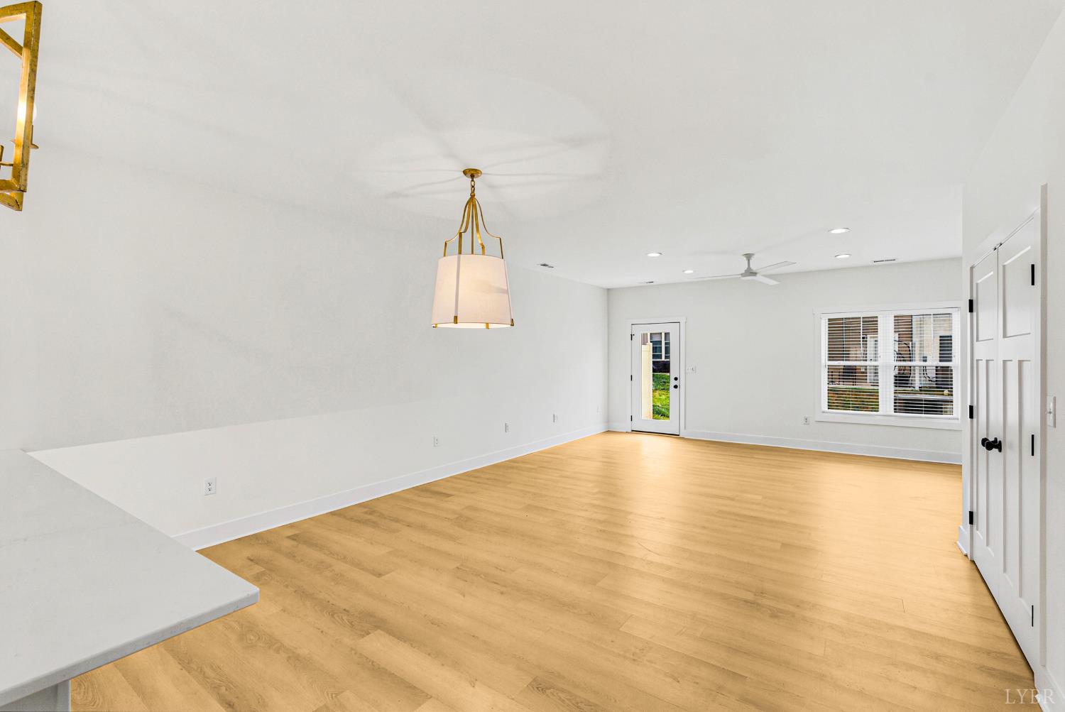 556 Leesville Road, Unit 406 Lynchburg, VA 24502 - Photo 7 of 39 a view of empty room with wooden floor and windows