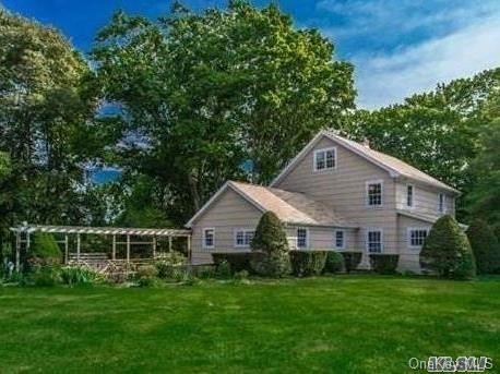 629 North Country Road Head of the Harbor, NY 11780 - Photo 1 of 1 a front view of house with a garden