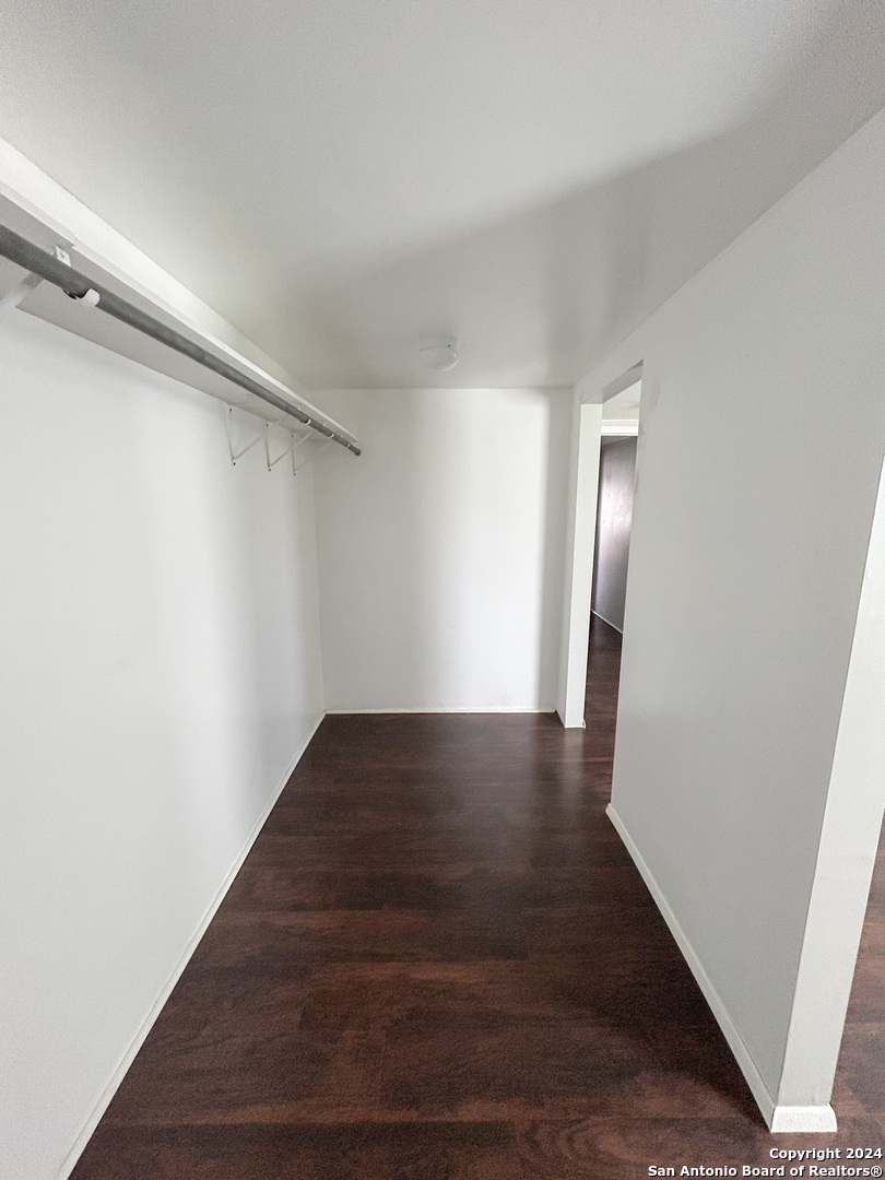 613 East Ireland Street Seguin, TX 78155 - Photo 14 of 42 a view of a hallway with wooden floor
