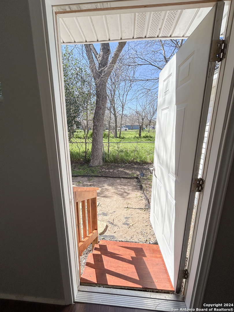 613 East Ireland Street Seguin, TX 78155 - Photo 36 of 42 a view of a door with a porch