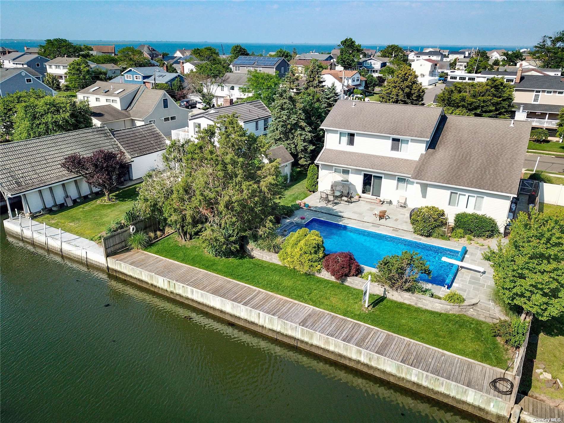 an aerial view of a house with a garden lake view
