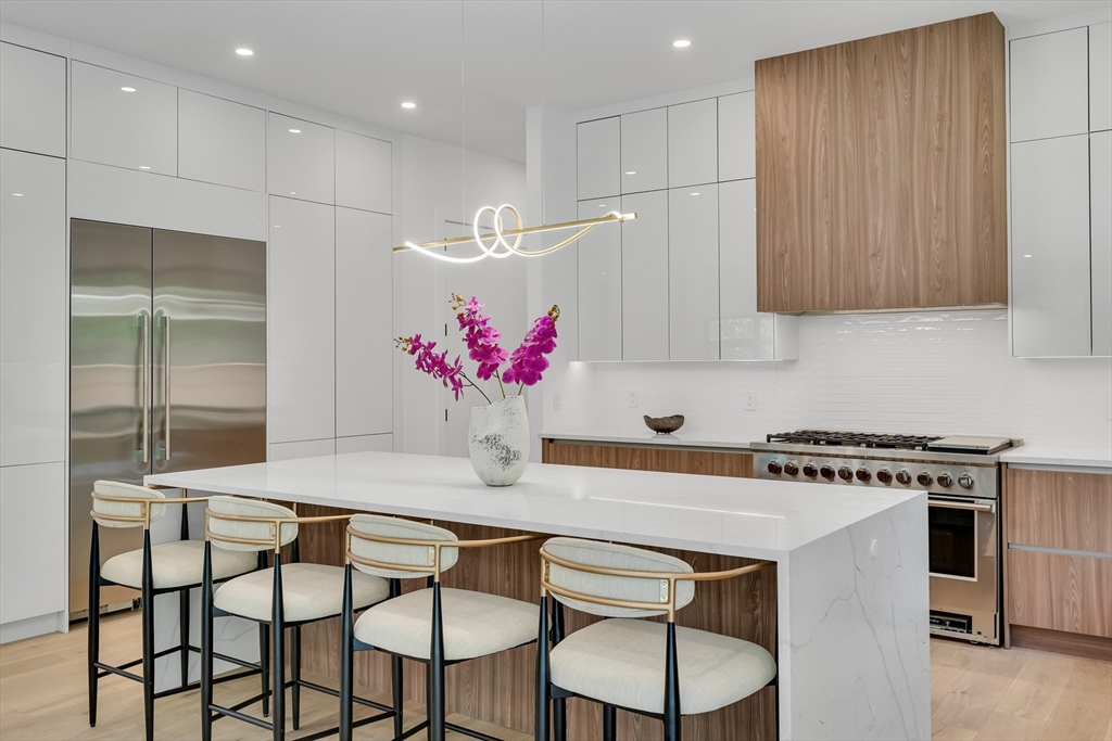 8 Winston Road Lexington, MA 02421 - Photo 17 of 42 a kitchen with a table and chairs in it