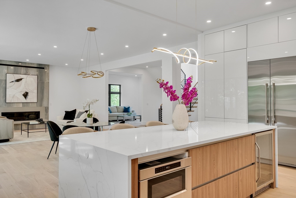 8 Winston Road Lexington, MA 02421 - Photo 18 of 42 a kitchen with stainless steel appliances kitchen island granite countertop a sink and cabinets