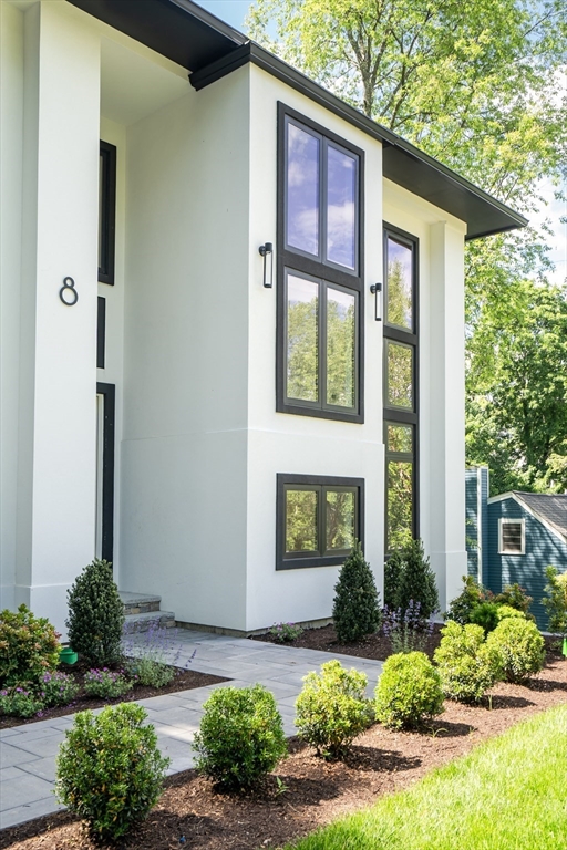 8 Winston Road Lexington, MA 02421 - Photo 2 of 42 a front view of a house with garden