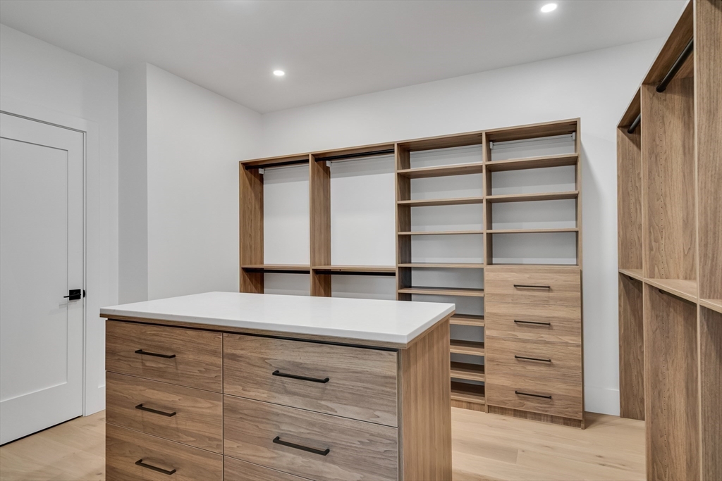 8 Winston Road Lexington, MA 02421 - Photo 26 of 42 a kitchen with a wooden floor and cabinets