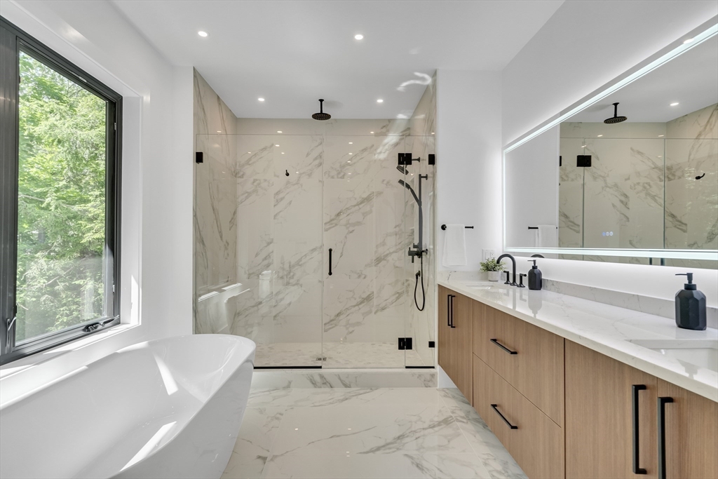 8 Winston Road Lexington, MA 02421 - Photo 27 of 42 a bathroom with a double vanity sink mirror and shower