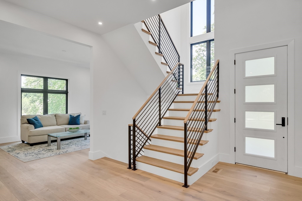 8 Winston Road Lexington, MA 02421 - Photo 28 of 42 a living room with furniture and stairs