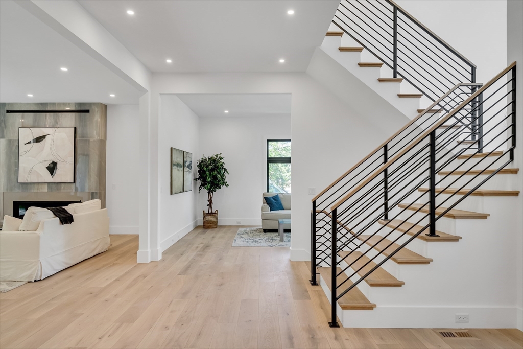 8 Winston Road Lexington, MA 02421 - Photo 30 of 42 wooden floor view with staircase and living room