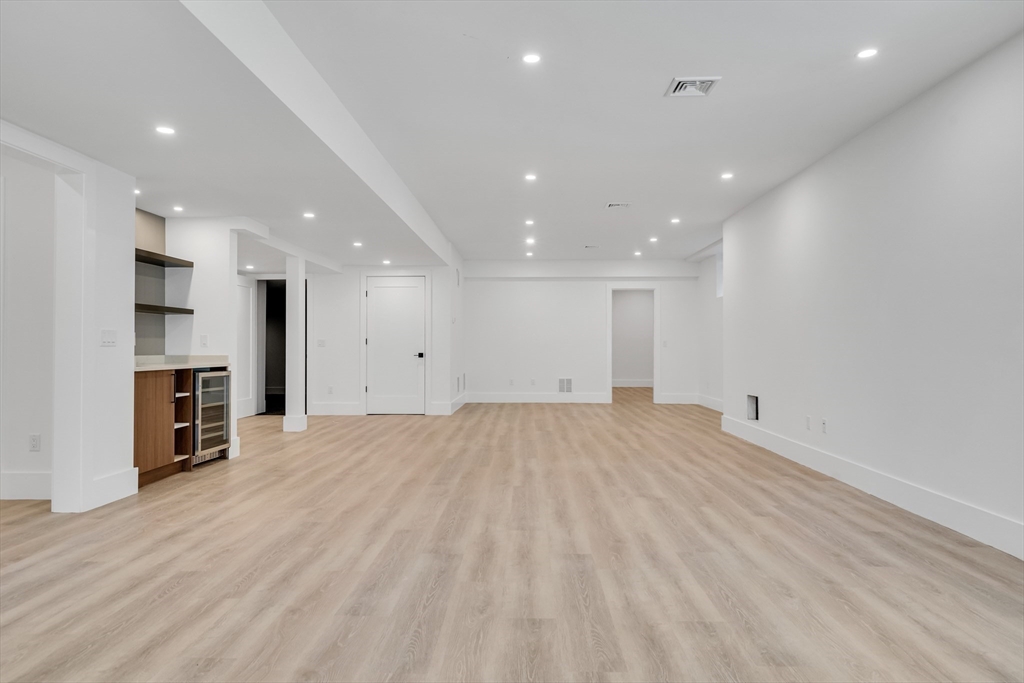 8 Winston Road Lexington, MA 02421 - Photo 38 of 42 a view of an empty room with a kitchen
