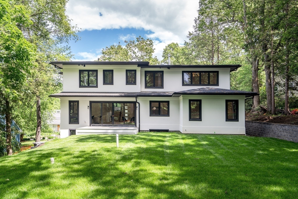 8 Winston Road Lexington, MA 02421 - Photo 42 of 42 a view of a yard in front of a house with large windows