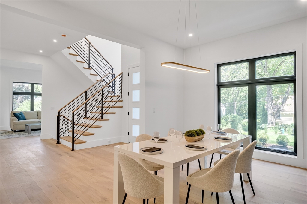 8 Winston Road Lexington, MA 02421 - Photo 7 of 42 a dining room with furniture and a floor to ceiling window