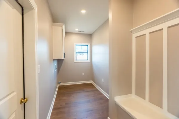 a view of hallway with wooden floor