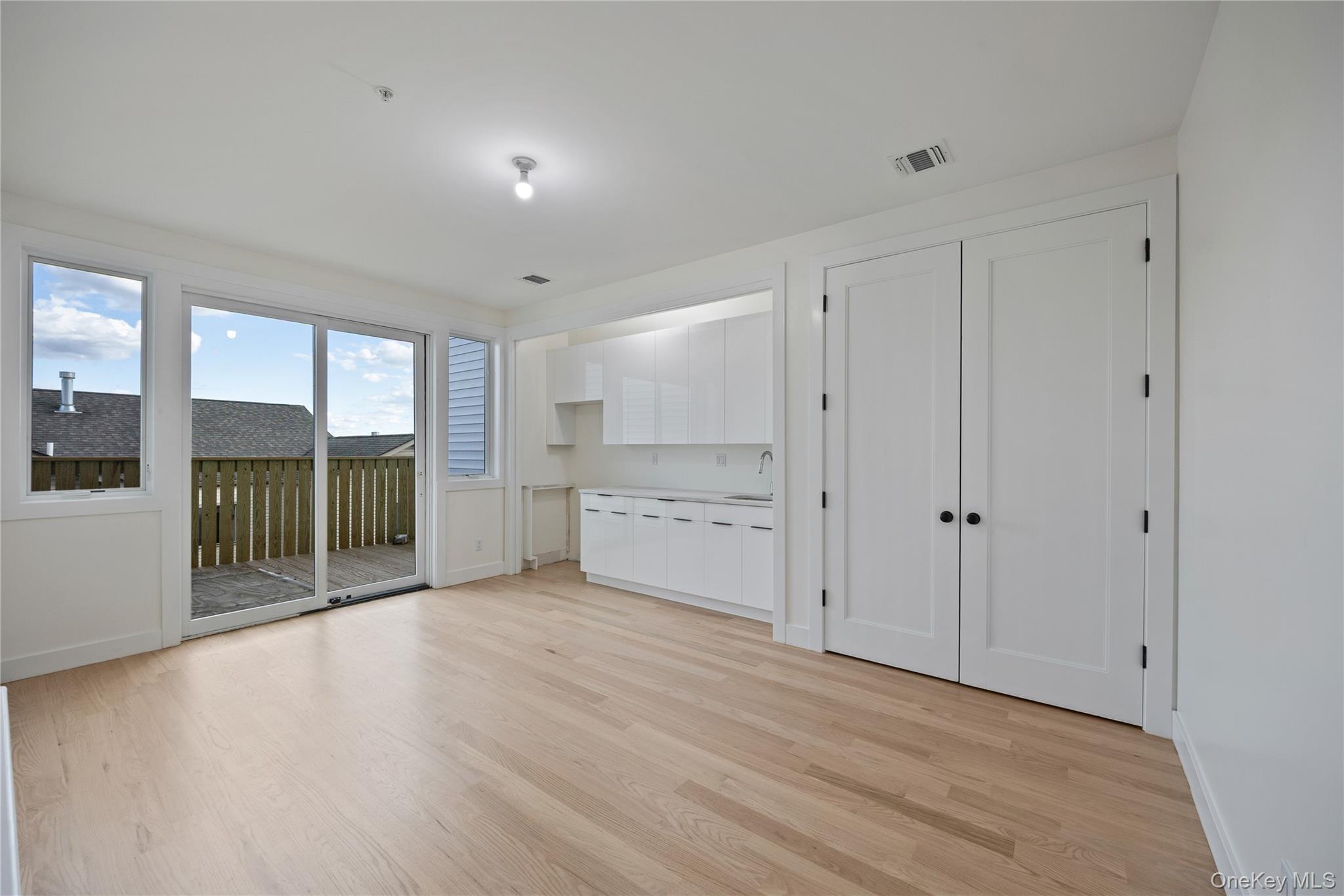 352 Blauvelt Road, Unit 202 Monsey, NY 10952 - Photo 11 of 33 a view of an empty room with wooden floor and a window