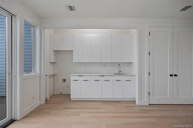 a view of a porch with wooden floor