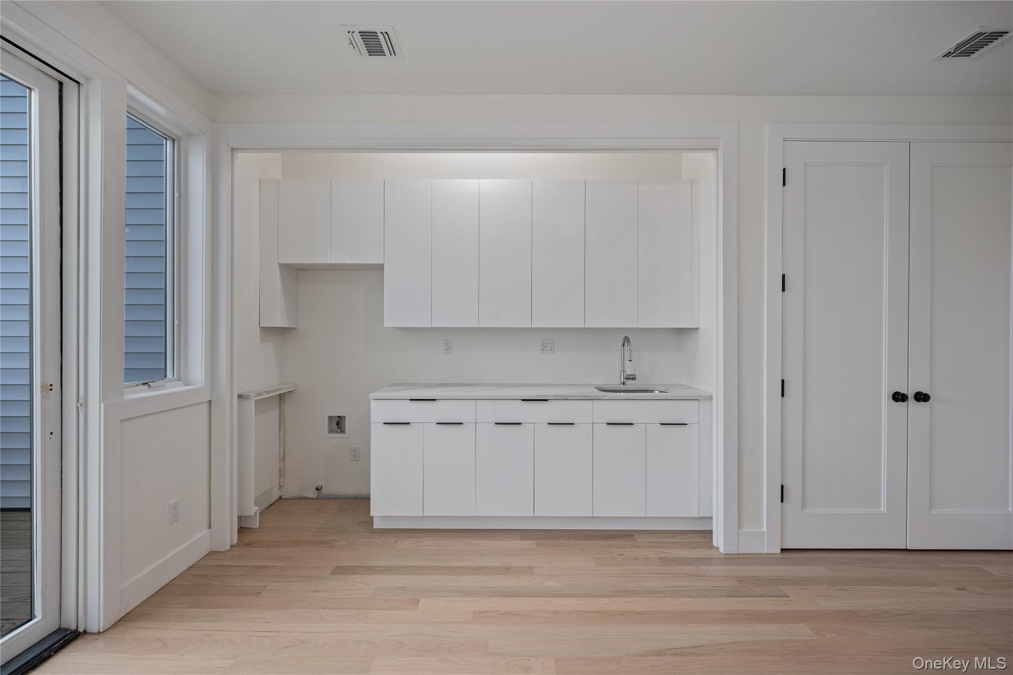 352 Blauvelt Road, Unit 202 Monsey, NY 10952 - Photo 12 of 33 a view of cabinets and wooden floor