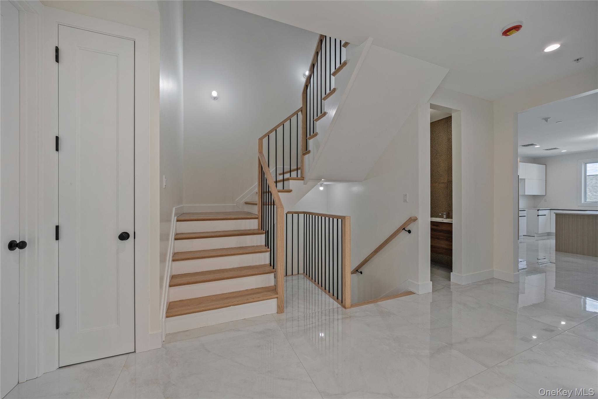 352 Blauvelt Road, Unit 202 Monsey, NY 10952 - Photo 16 of 33 a view of a hallway with staircase and white walls