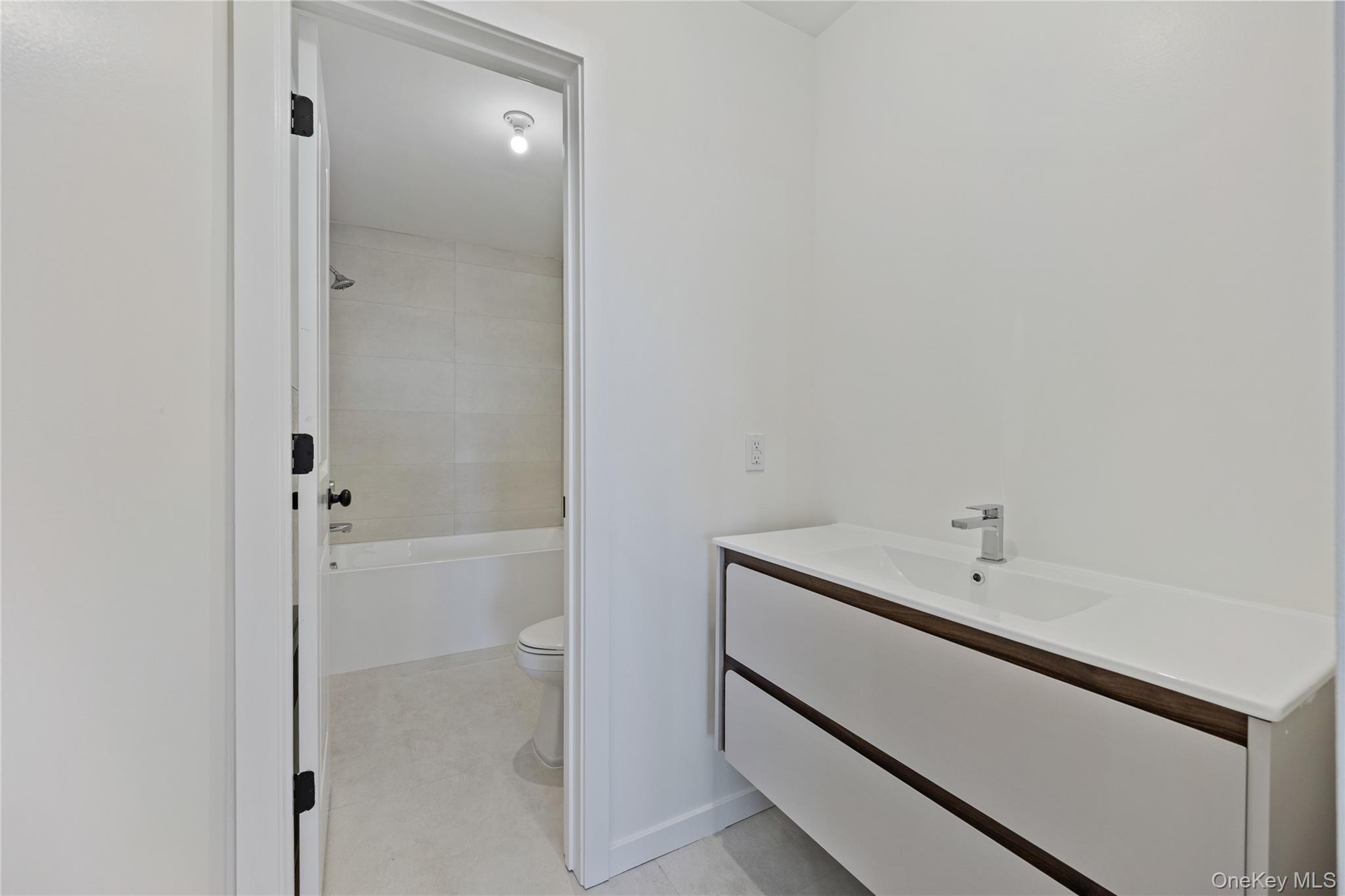 352 Blauvelt Road, Unit 202 Monsey, NY 10952 - Photo 19 of 33 a bathroom with a bathtub and shower