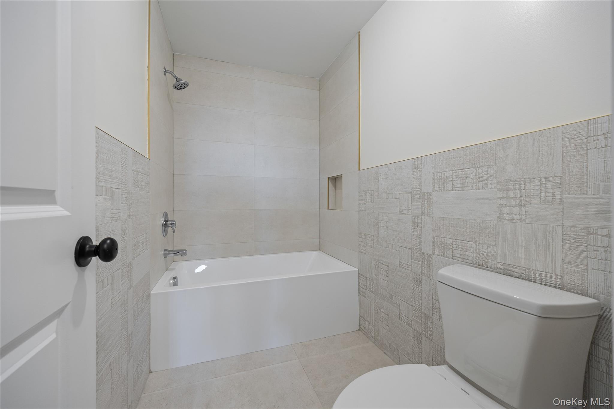 352 Blauvelt Road, Unit 202 Monsey, NY 10952 - Photo 20 of 33 a white toilet sitting next to a bath tub