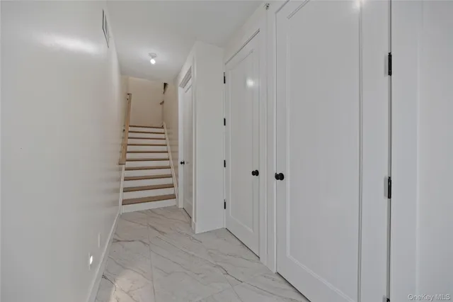 a view of a hallway with stairs