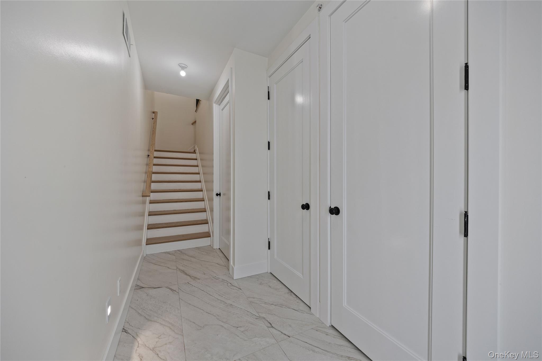 352 Blauvelt Road, Unit 202 Monsey, NY 10952 - Photo 2 of 33 a view of a hallway with wooden floor and entryway