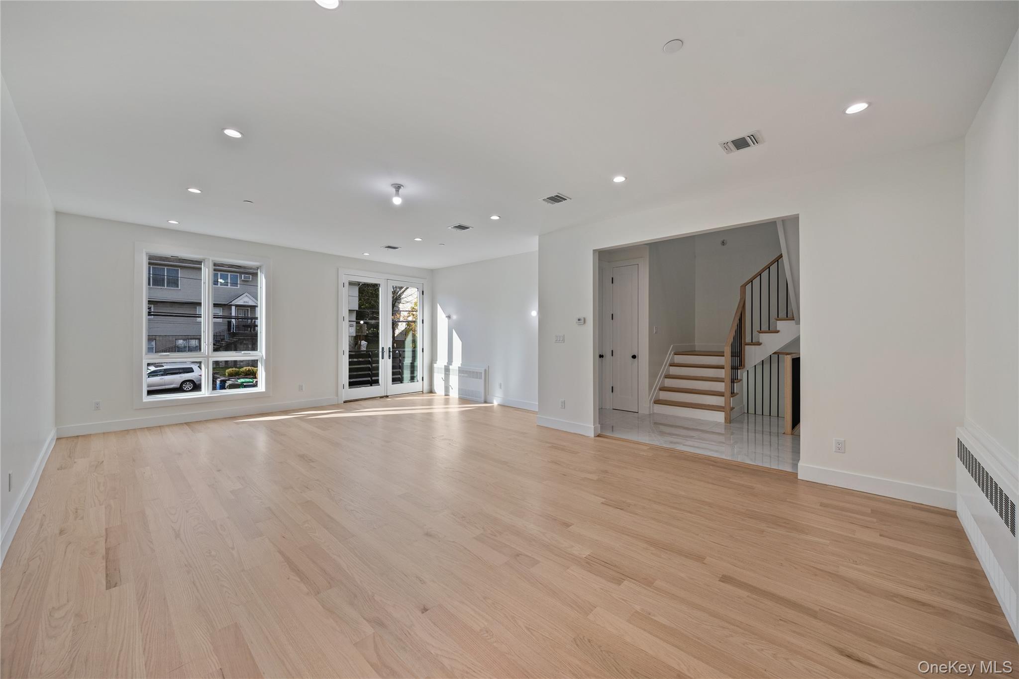 352 Blauvelt Road, Unit 202 Monsey, NY 10952 - Photo 4 of 33 a view of empty room with wooden floor and windows