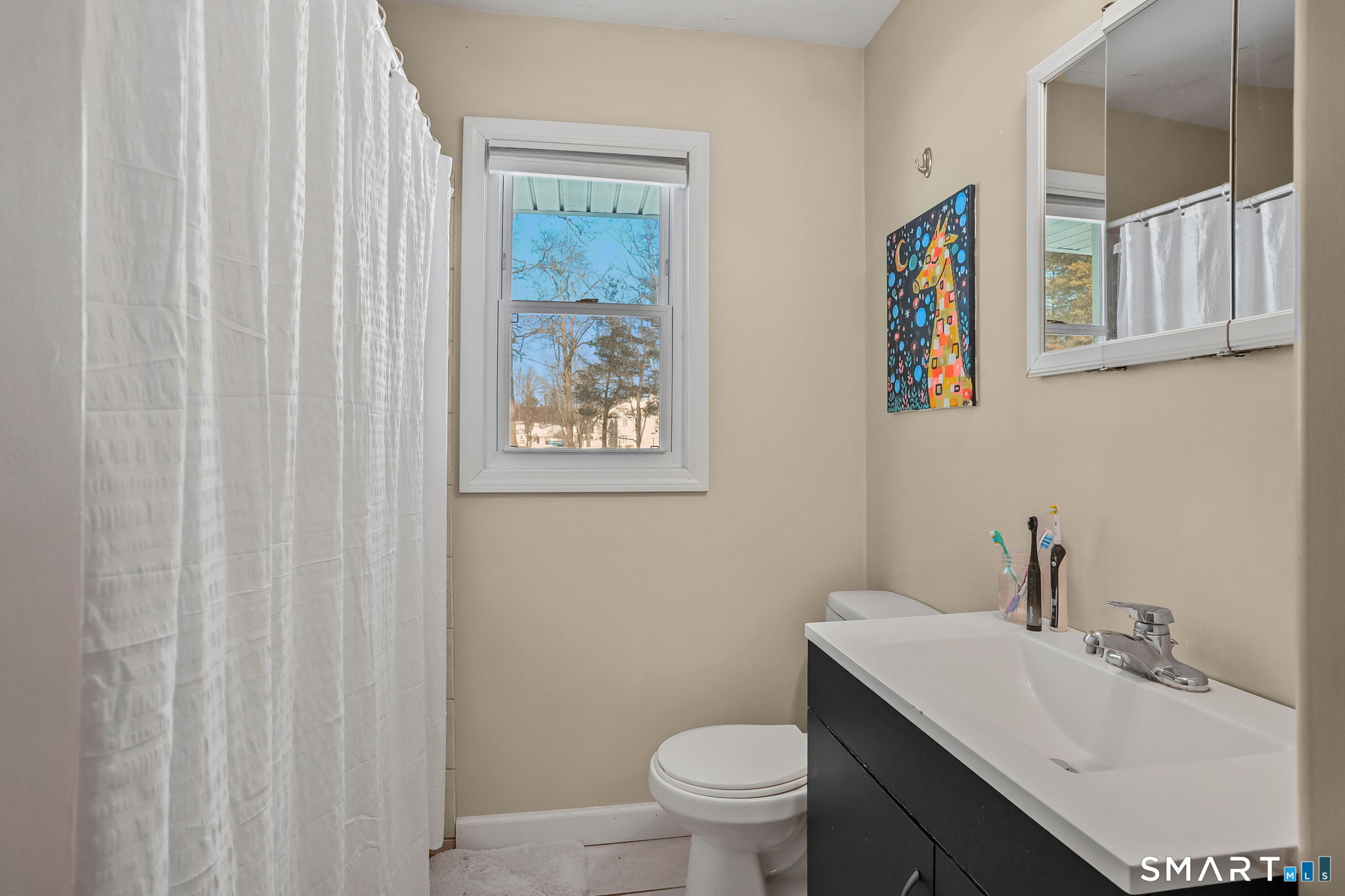 3460 Old Town Road Bridgeport, CT 06606 - Photo 17 of 34 a bathroom with a sink toilet and vanity