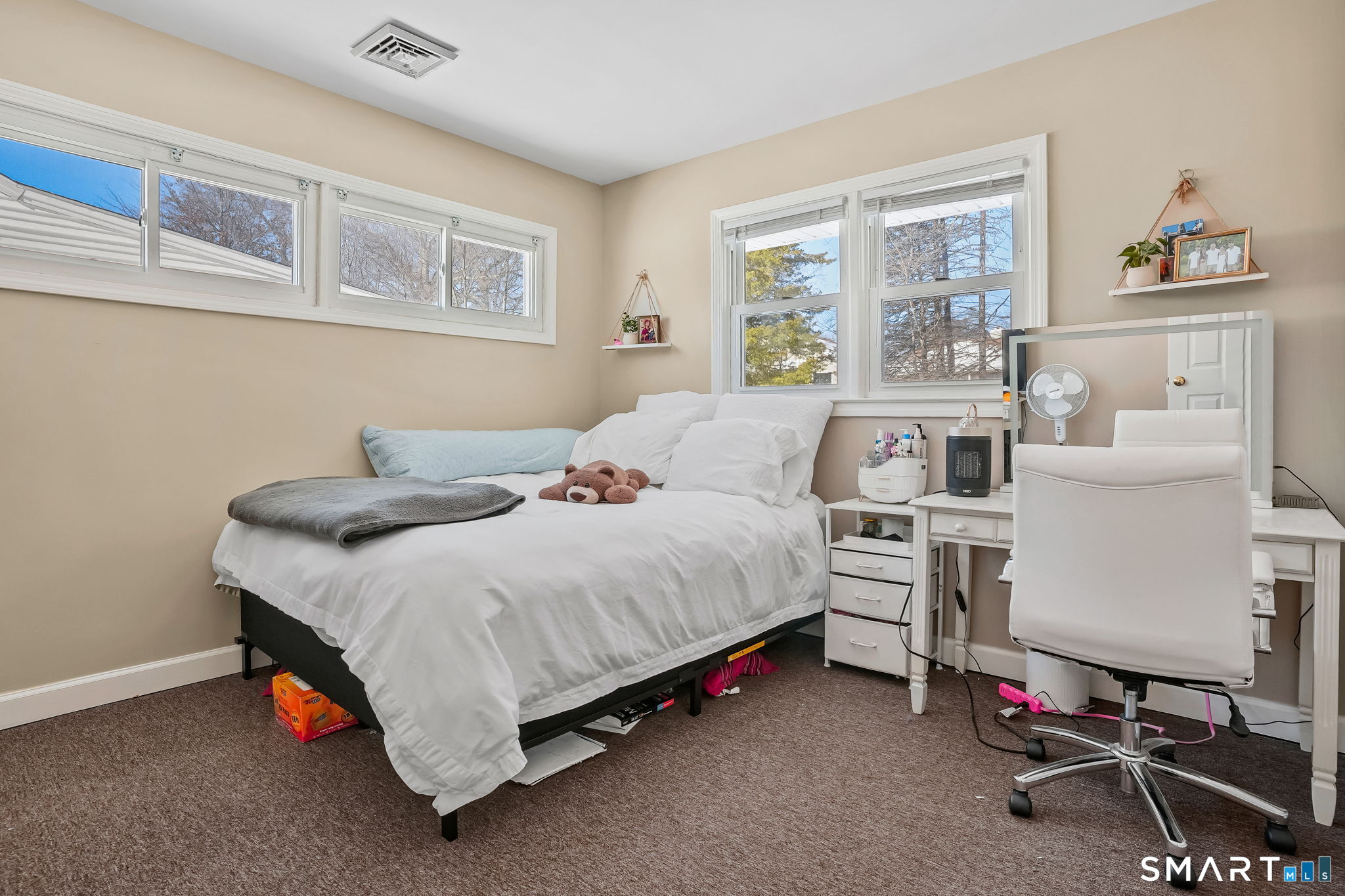 3460 Old Town Road Bridgeport, CT 06606 - Photo 19 of 34 a bedroom with a bed and a table in it