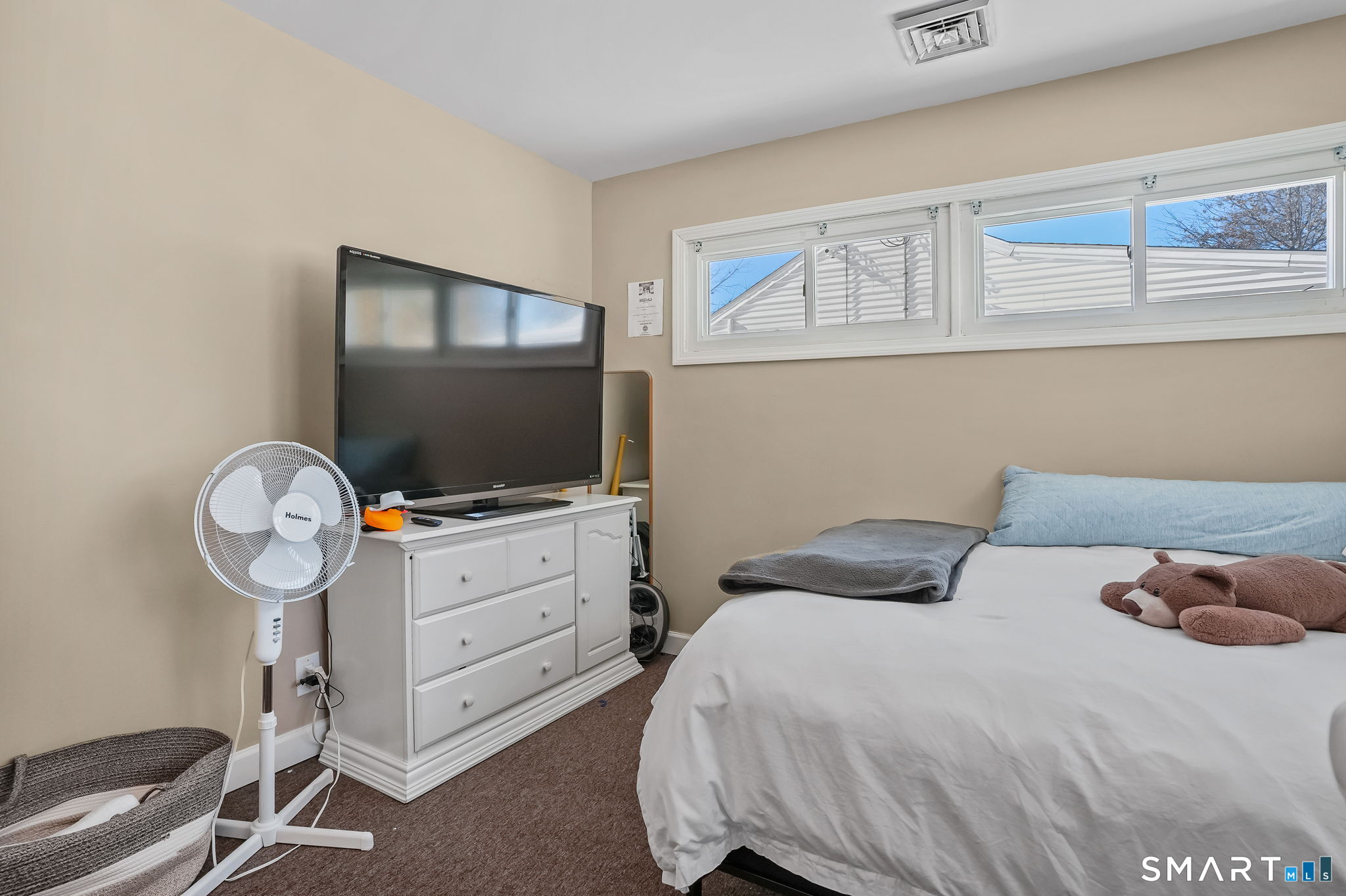 3460 Old Town Road Bridgeport, CT 06606 - Photo 21 of 34 a bedroom with a bed and flat screen tv