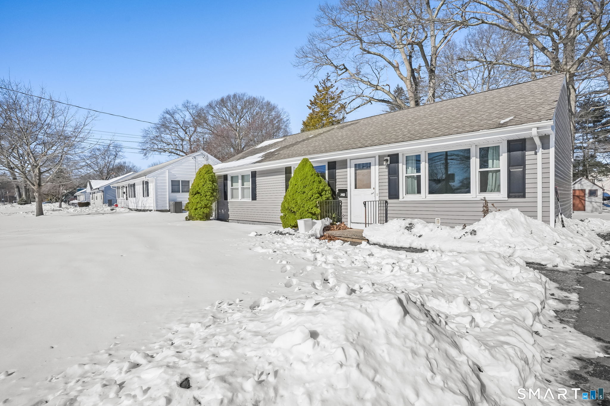 3460 Old Town Road Bridgeport, CT 06606 - Photo 32 of 34 a front view of a house with a yard