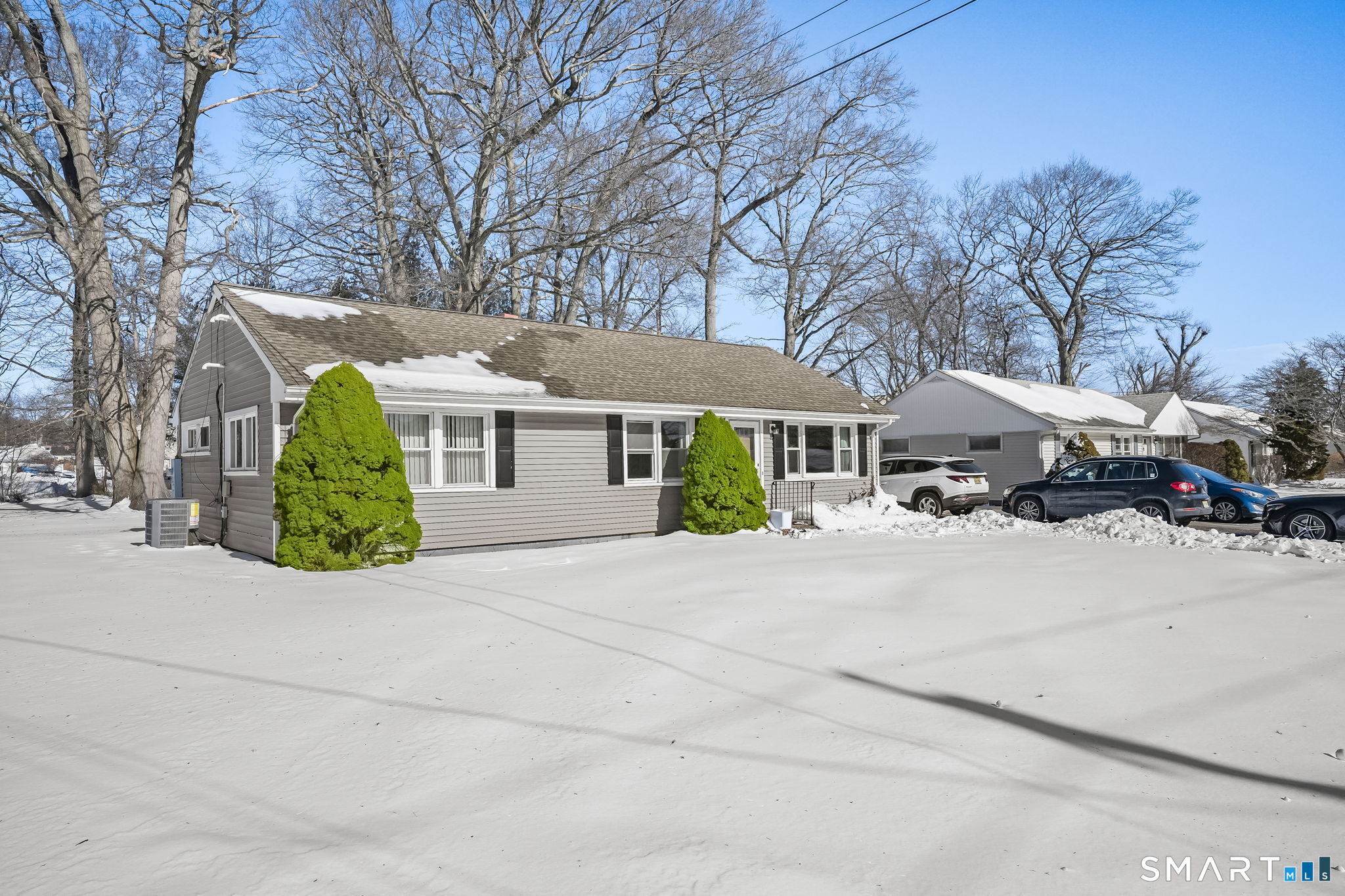 3460 Old Town Road Bridgeport, CT 06606 - Photo 33 of 34 a front view of a house with a garden and trees