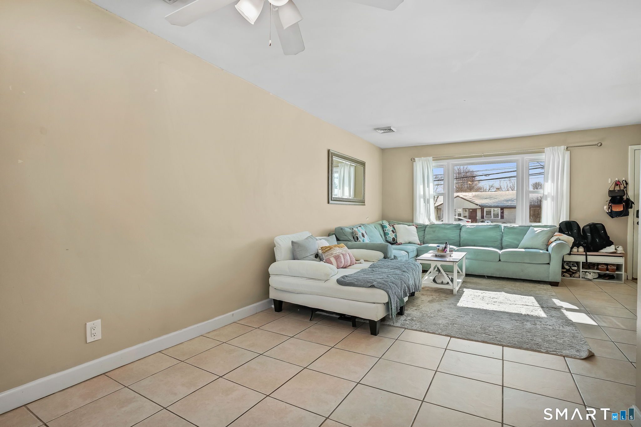 3460 Old Town Road Bridgeport, CT 06606 - Photo 6 of 34 a living room with furniture and a window