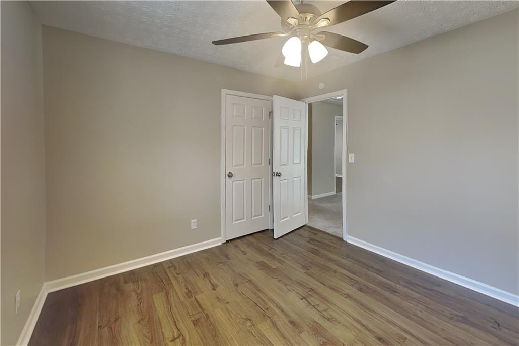 2730 Jona Trail Dacula, GA 30019 - Photo 15 of 19 wooden floor in an empty room