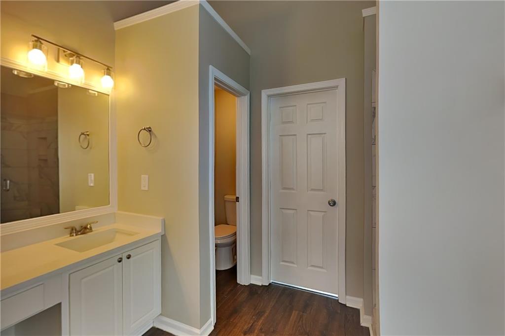 2730 Jona Trail Dacula, GA 30019 - Photo 8 of 19 a bathroom with a sink a mirror and a shower