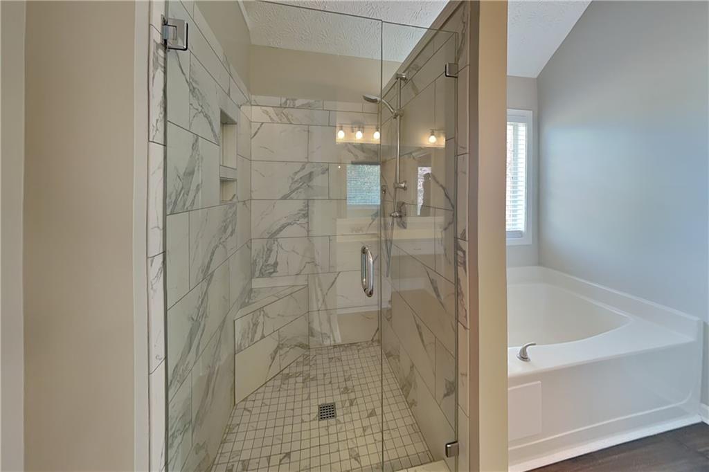 2730 Jona Trail Dacula, GA 30019 - Photo 9 of 19 a bathroom with a shower