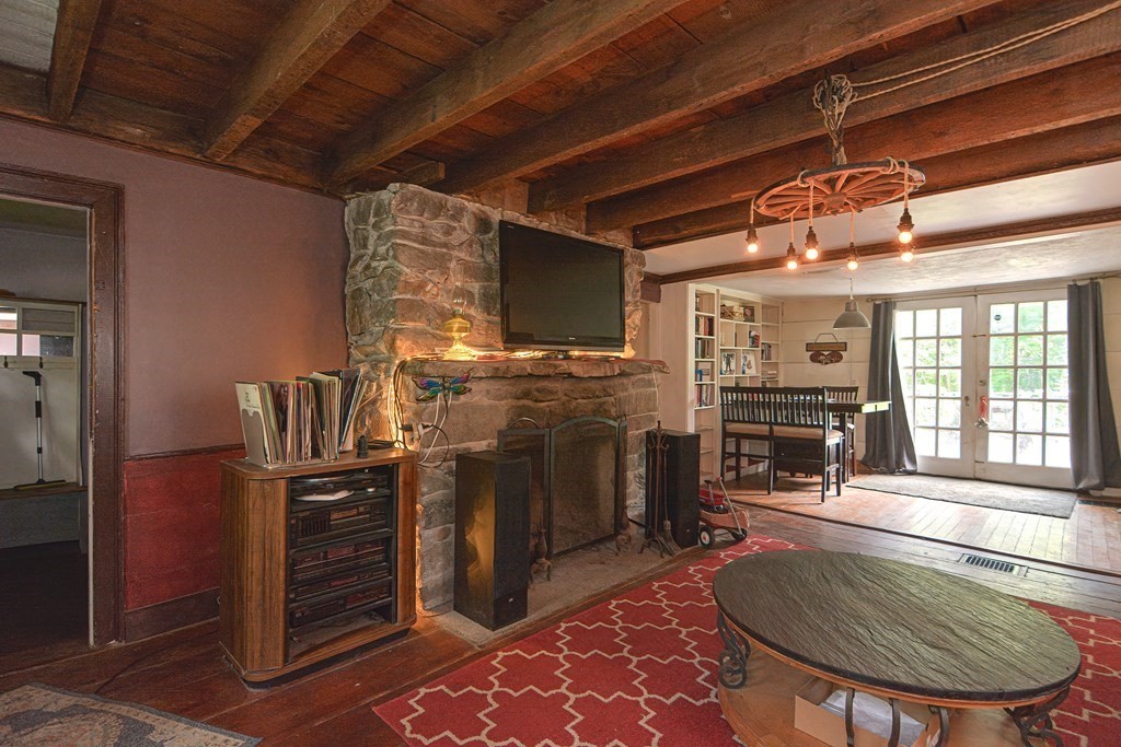 215 Burlingame Road Palmer, MA 01069 - Photo 12 of 41 a room with fireplace furniture and a rug
