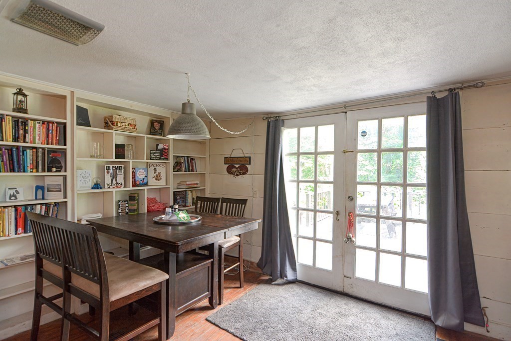 215 Burlingame Road Palmer, MA 01069 - Photo 15 of 41 a workspace with furniture and a book shelf