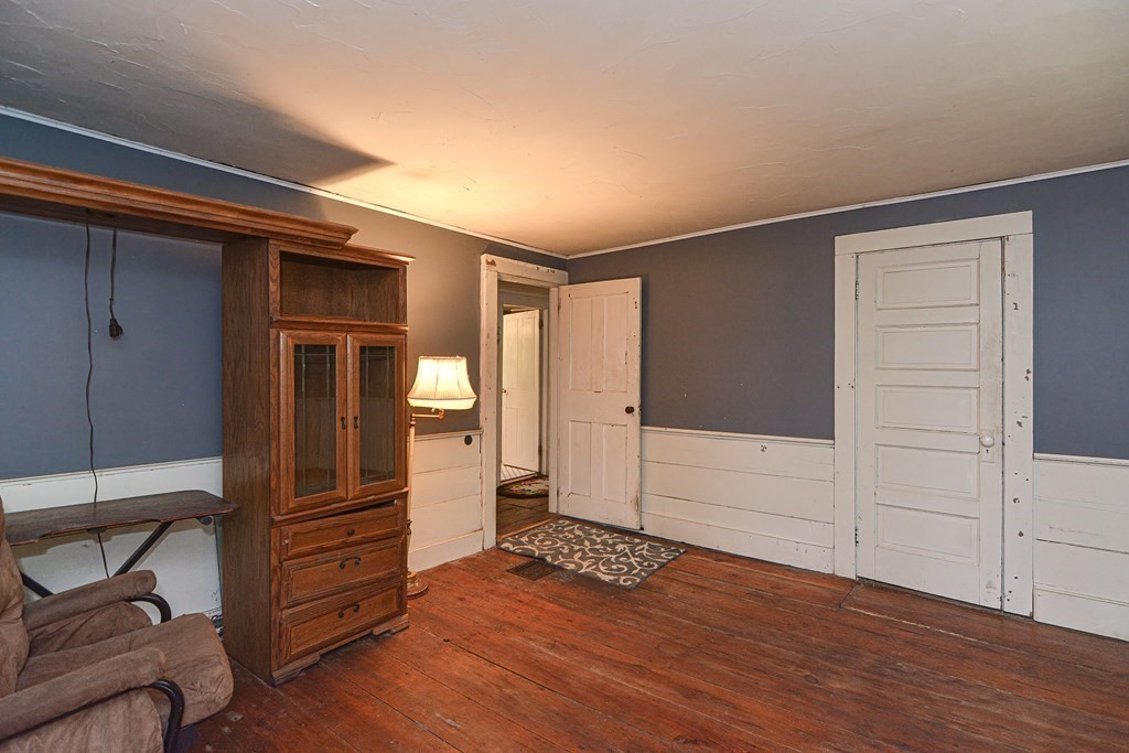 215 Burlingame Road Palmer, MA 01069 - Photo 19 of 41 an empty room with wooden floor and windows