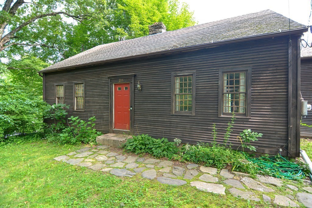 215 Burlingame Road Palmer, MA 01069 - Photo 2 of 41 a front view of a house with a yard