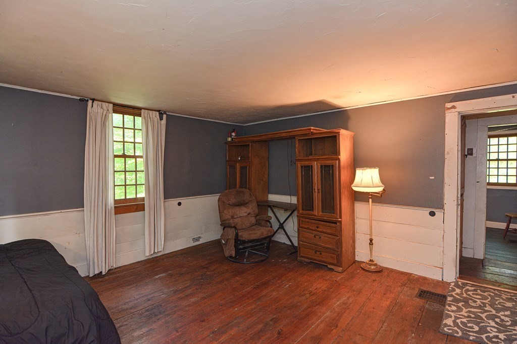 215 Burlingame Road Palmer, MA 01069 - Photo 21 of 41 a view of a livingroom with furniture and staircase